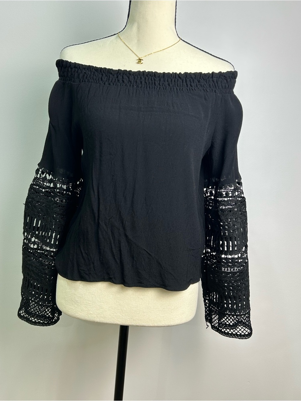 Olivaceous Black Off-Shoulder Blouse with Crochet Bell Sleeves